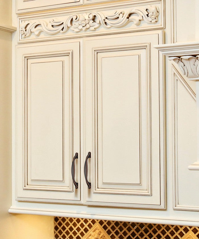 Display of Classic Vintage Kitchen Hardware - Elora Cabinet Handles on Cream-colored Vintage Cabinet