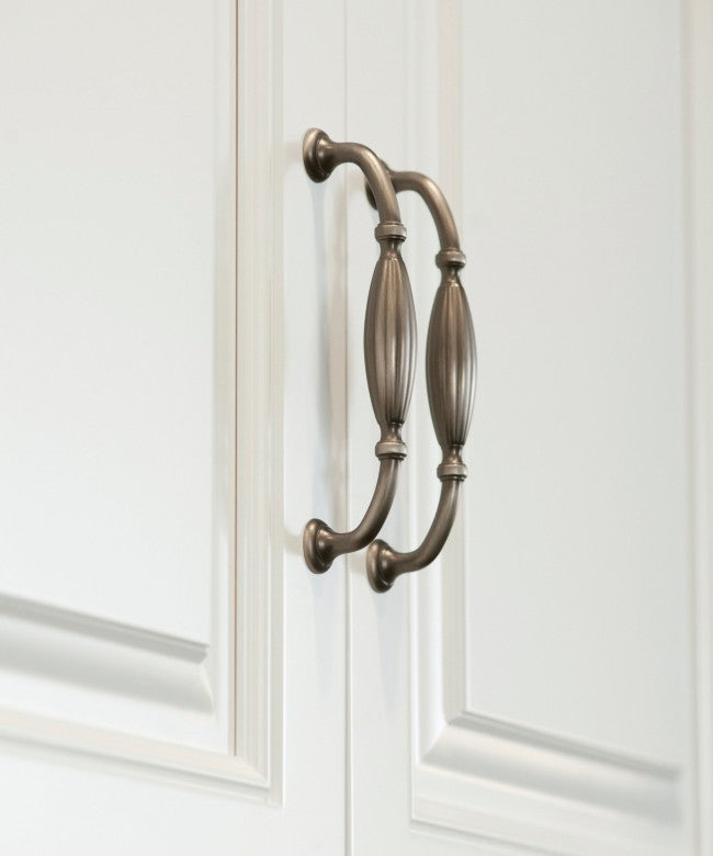Display of Vintage French Style Lampton Cabinet Handle and Pull Mounted on the White Cabinet 