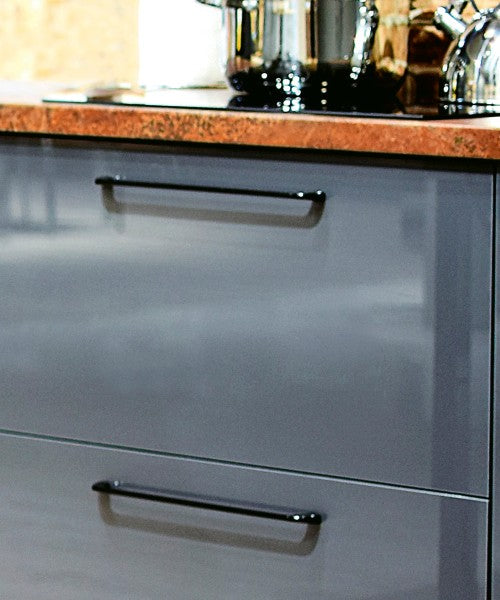 Westhill Matte Black Handle Collection Mounted on Dark Gray Kitchen Cabinet Drawer