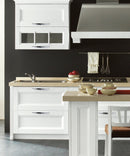 Loretto Twist Cabinet Handle Pull in Polished Chrome Mounted on the White Kitchen Cabinet