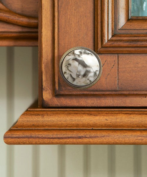Southdale 2 Bronze Round Kitchen Knob Mounted on Wooden Cabinet