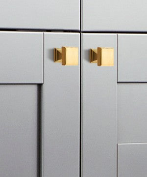 Display of Luxury Designer Cabinet Hardware - Deleware Square Cabinet Door Knob in Brushed Brass