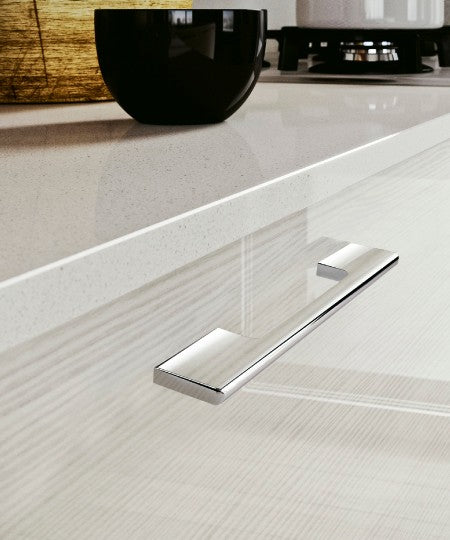 Polished Chrome Luxury Design Kleinburg Cabinet Pull and Handle Mounted on the White Kitchen Drawer