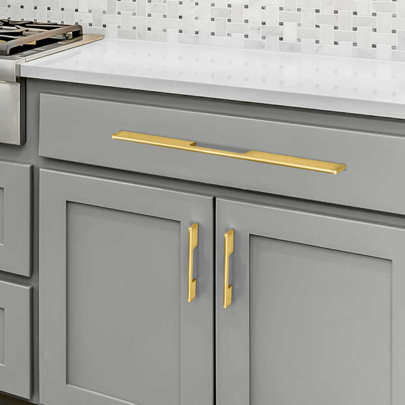  Brushed Brass Luxury Design Kleinburg Cabinet Pull and Handle Mounted on the Gray Kitchen Cabinet
